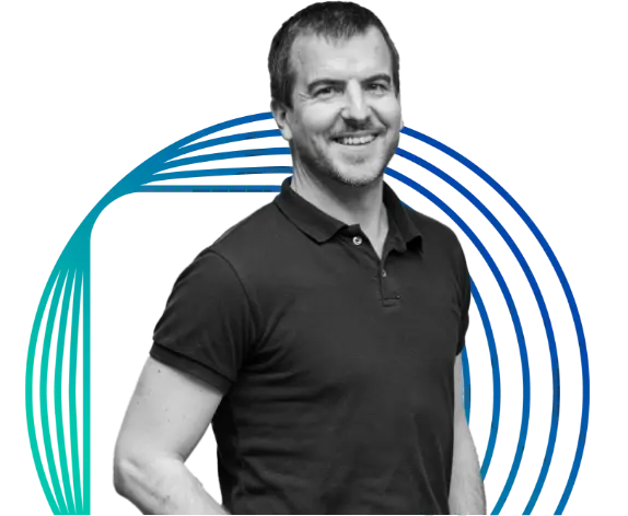 a man wearing black polo shirt smiling